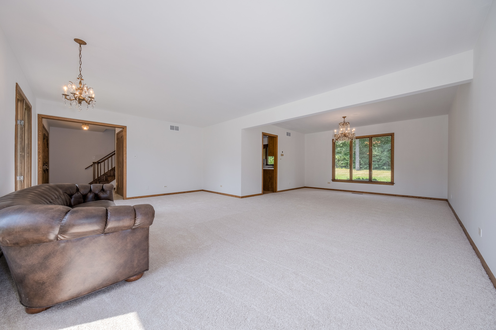 8436 Clynderven Road Burr Ridge, IL 60527 - Photo 7 of 39 a view of an empty room with a window
