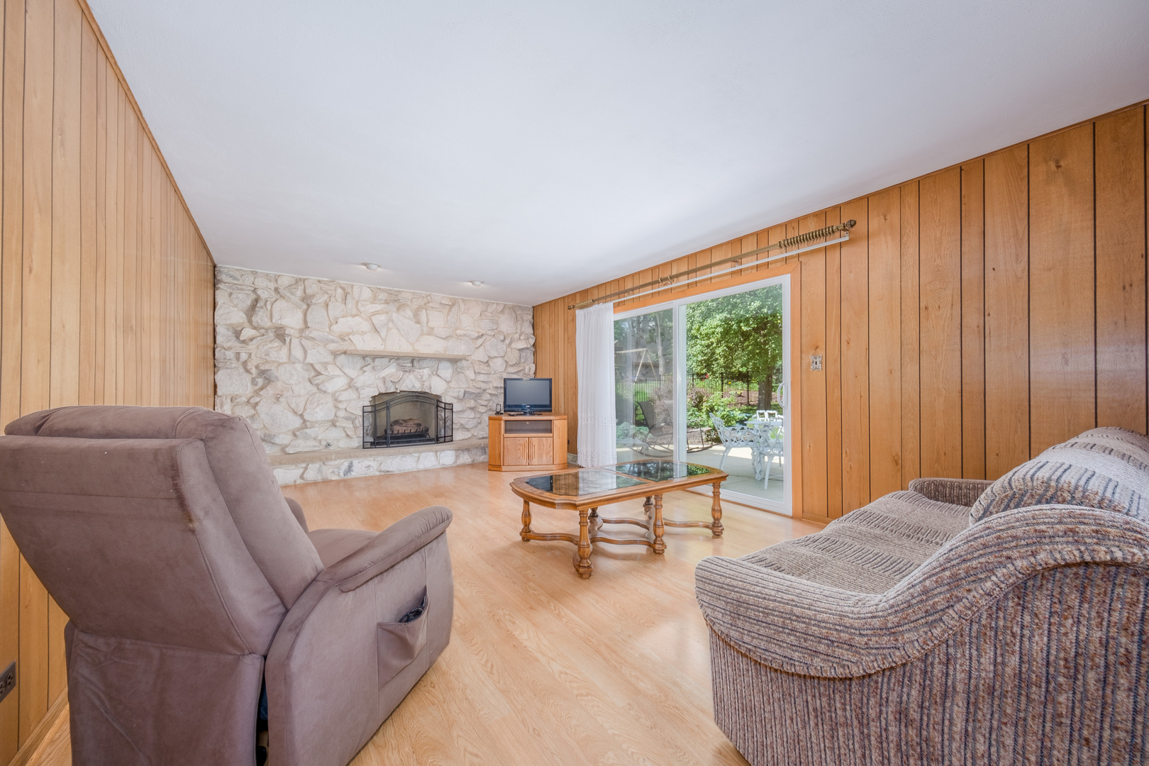 8436 Clynderven Road Burr Ridge, IL 60527 - Photo 9 of 39 a living room with furniture and a fireplace