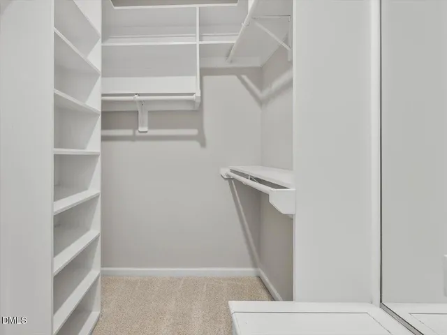 a view of staircase with wooden floor and a fireplace