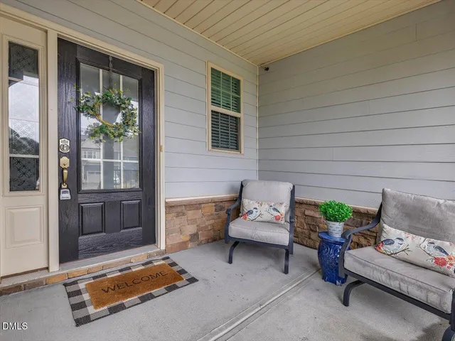 a outdoor living space with furniture and a potted plant