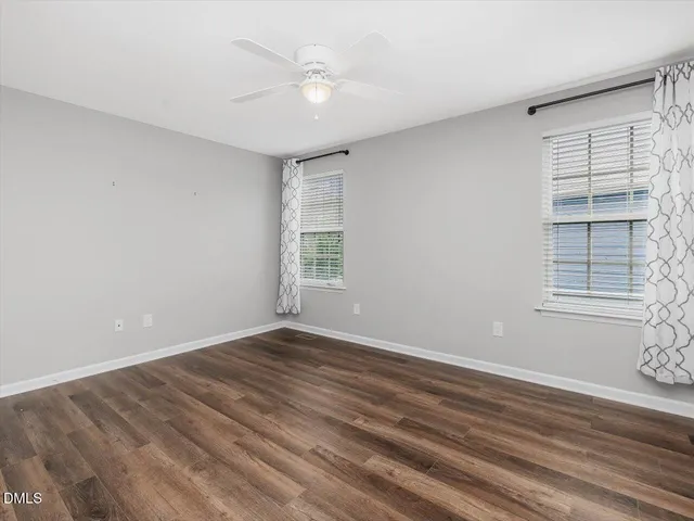 a kitchen with granite countertop white cabinets and a sink