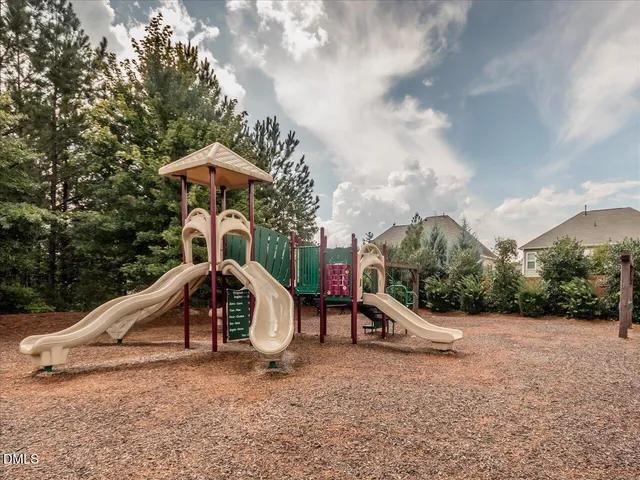 a view of swimming pool with a yard and sitting area