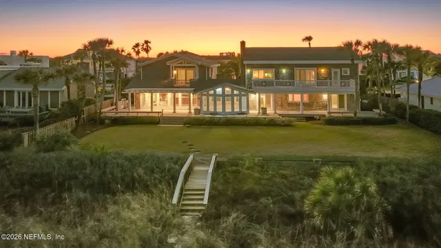 a kitchen with stainless steel appliances granite countertop a kitchen island a stove a sink and a refrigerator