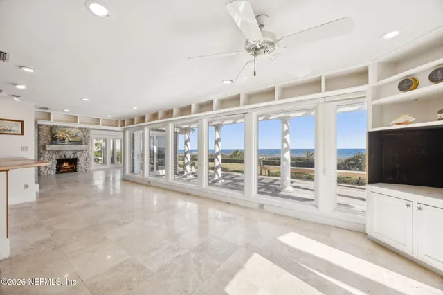 a view of a balcony with wooden floor and outdoor space