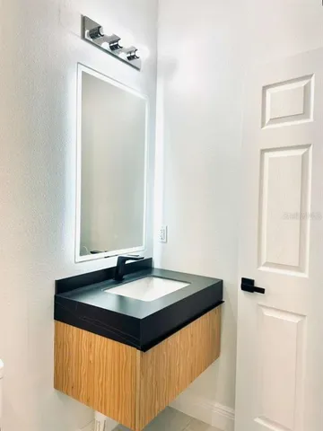 a close view of a sink and a mirror