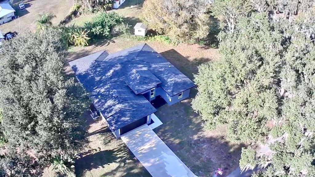 121 Argyle Avenue Frostproof, FL 33843 - Photo 4 of 26 a view of a tree in a yard