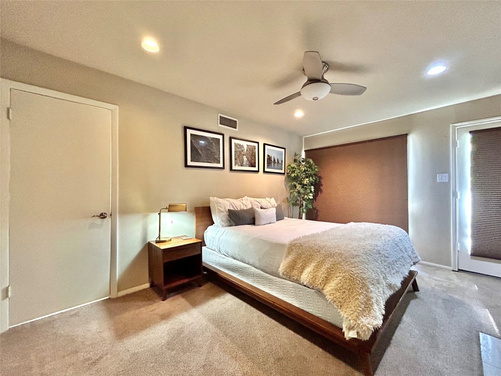 1106 West 6th Street, Unit 205 Austin, TX 78703 - Photo 18 of 27 Bedroom featuring carpet floors, ceiling fan, and recessed lighting
