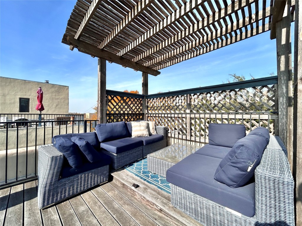 1106 West 6th Street, Unit 205 Austin, TX 78703 - Photo 26 of 27 Wooden terrace with an outdoor hangout area
