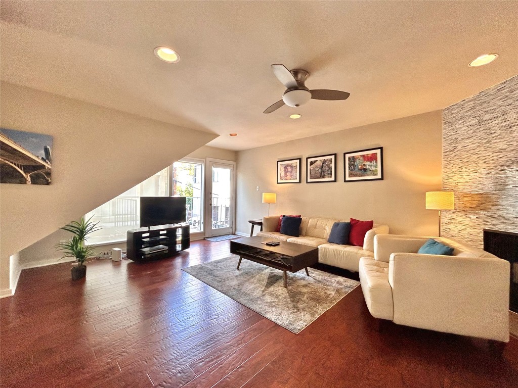1106 West 6th Street, Unit 205 Austin, TX 78703 - Photo 4 of 27 Living room with a ceiling fan, recessed lighting, dark wood-style floors, and a textured ceiling