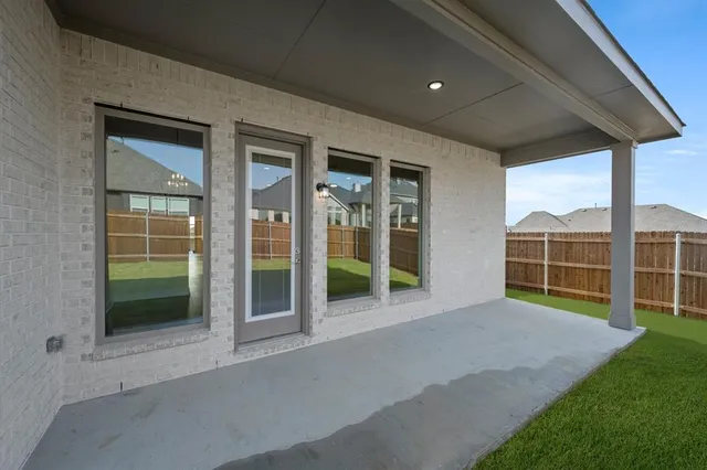 a view of an empty room with a balcony