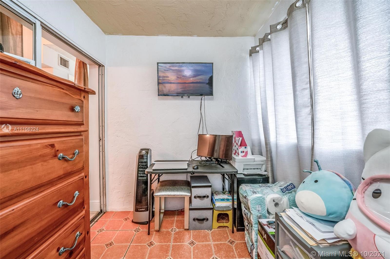 5720 Rock Island Road, Unit 391 Tamarac, FL 33319 - Photo 19 of 27 a view of a workspace with furniture and a window