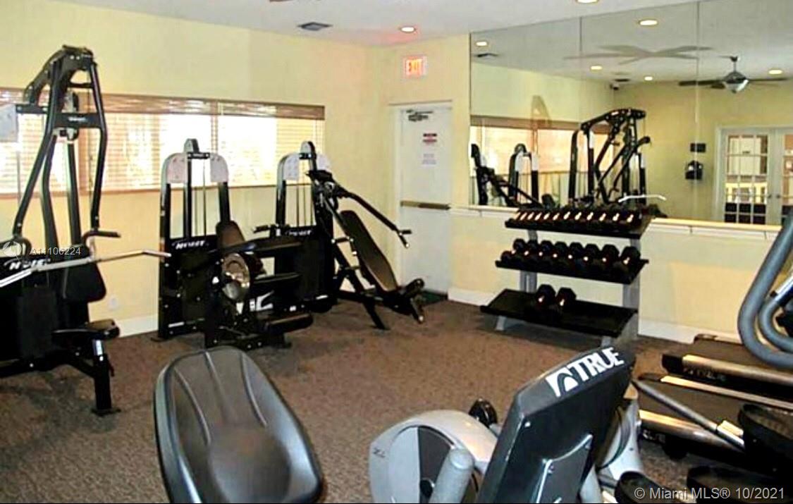5720 Rock Island Road, Unit 391 Tamarac, FL 33319 - Photo 22 of 27 a view of a room with gym equipment