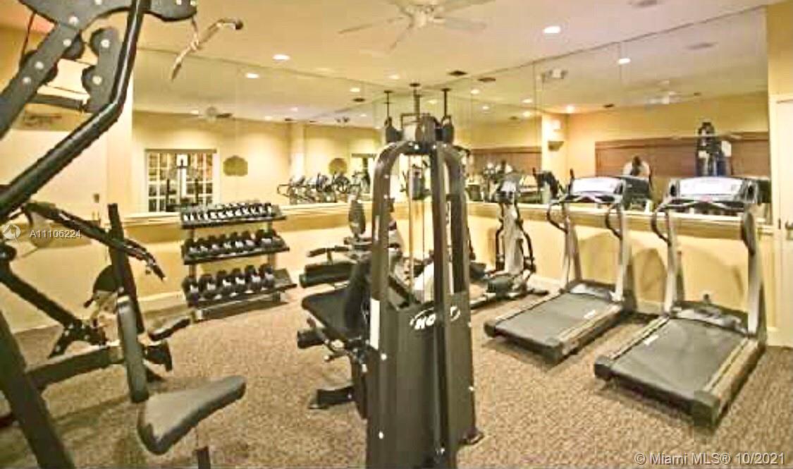 5720 Rock Island Road, Unit 391 Tamarac, FL 33319 - Photo 23 of 27 a view of a room with gym equipment