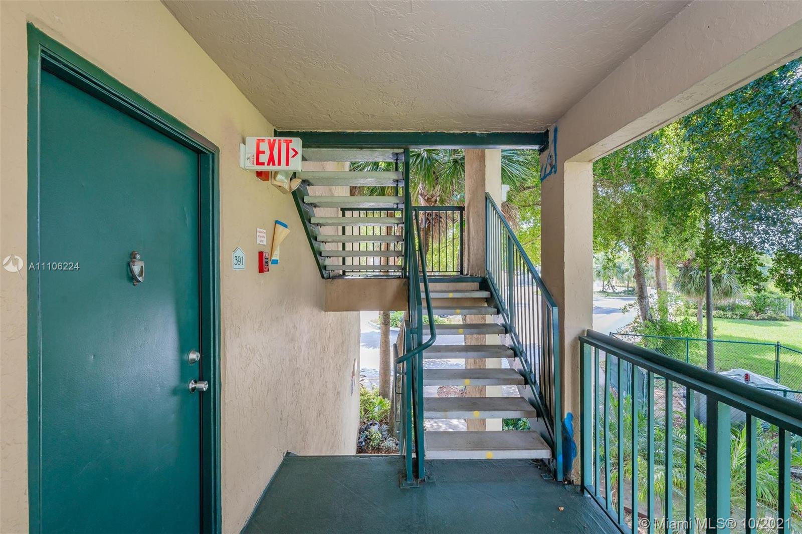 5720 Rock Island Road, Unit 391 Tamarac, FL 33319 - Photo 25 of 27 a view of entryway with stairs
