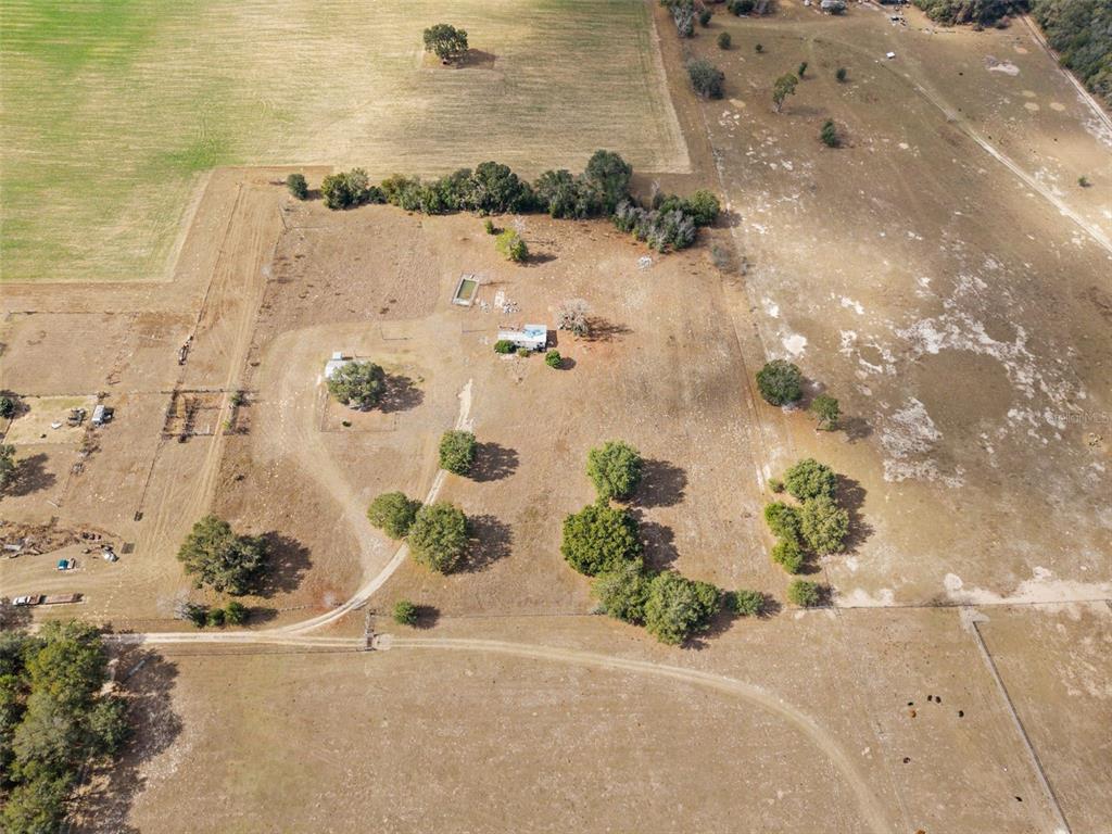 11406 Southwest 274 Street Newberry, FL 32669 - Photo 12 of 14 an aerial view of a house with a yard and lake view