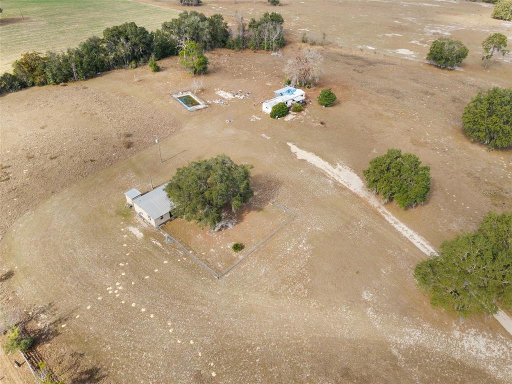 11406 Southwest 274 Street Newberry, FL 32669 - Photo 5 of 14 a view of a street with a yard