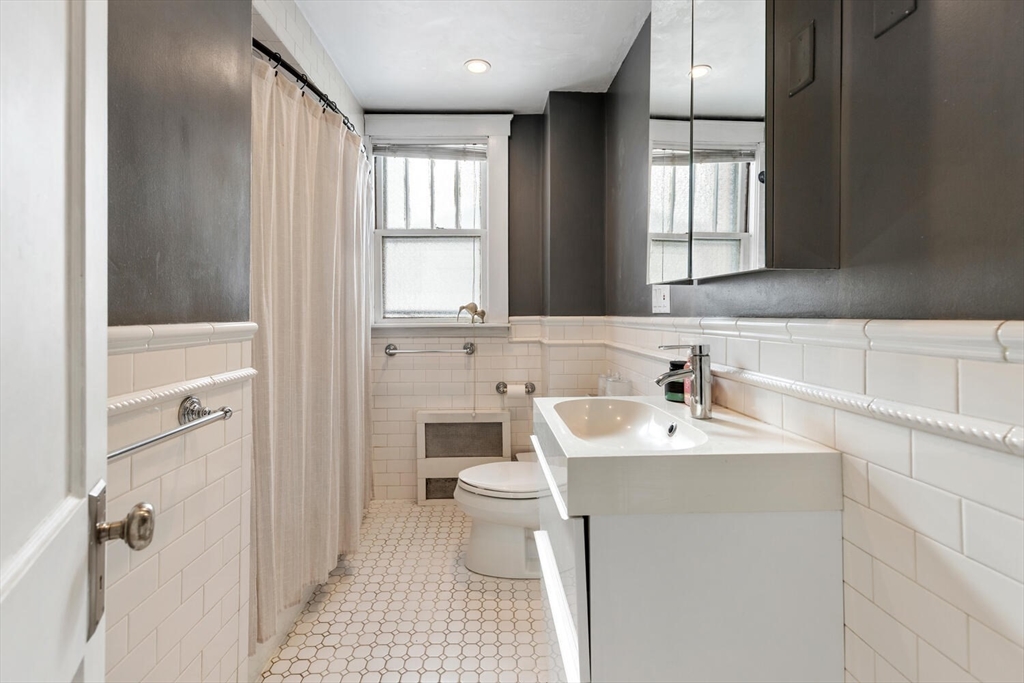178 Norfolk Avenue, Unit 178 Swampscott, MA 01907 - Photo 22 of 33 a bathroom with a sink toilet a mirror and shower