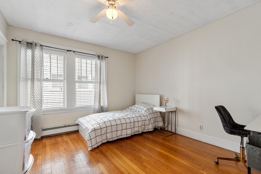 178 Norfolk Avenue, Unit 178 Swampscott, MA 01907 - Photo 23 of 33 a bedroom with a bed and a large window