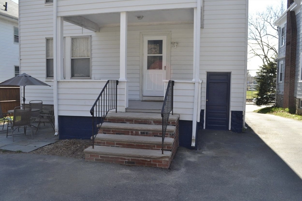 178 Norfolk Avenue, Unit 178 Swampscott, MA 01907 - Photo 28 of 33 a view of a house with a stairs and a yard