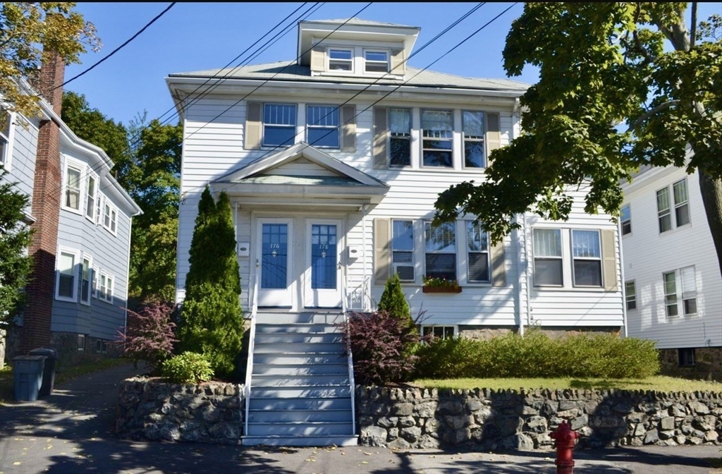 178 Norfolk Avenue, Unit 178 Swampscott, MA 01907 - Photo 30 of 33 front view of a house with a small yard