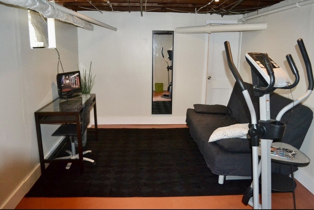 178 Norfolk Avenue, Unit 178 Swampscott, MA 01907 - Photo 32 of 33 a view of a workspace with furniture and wooden floor