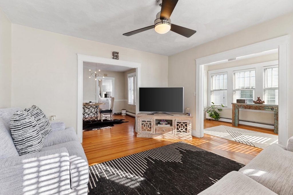 178 Norfolk Avenue, Unit 178 Swampscott, MA 01907 - Photo 4 of 33 a bedroom with furniture and a flat screen tv