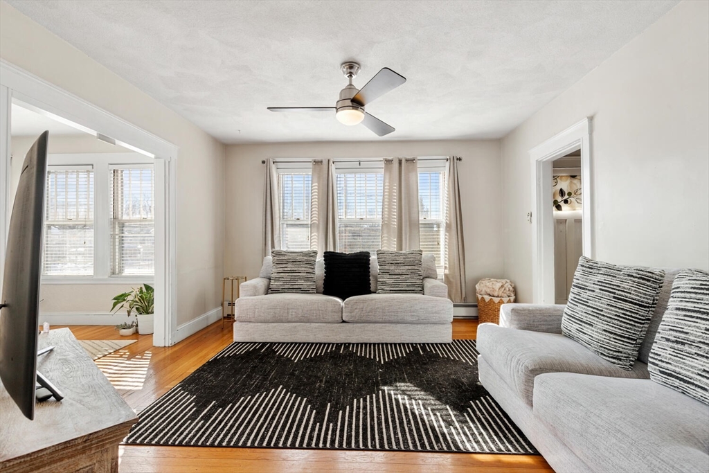 178 Norfolk Avenue, Unit 178 Swampscott, MA 01907 - Photo 5 of 33 a living room with furniture or couch and a window