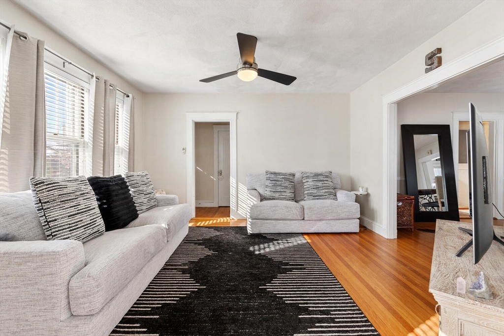 178 Norfolk Avenue, Unit 178 Swampscott, MA 01907 - Photo 7 of 33 a living room with furniture or couch and a wooden floor