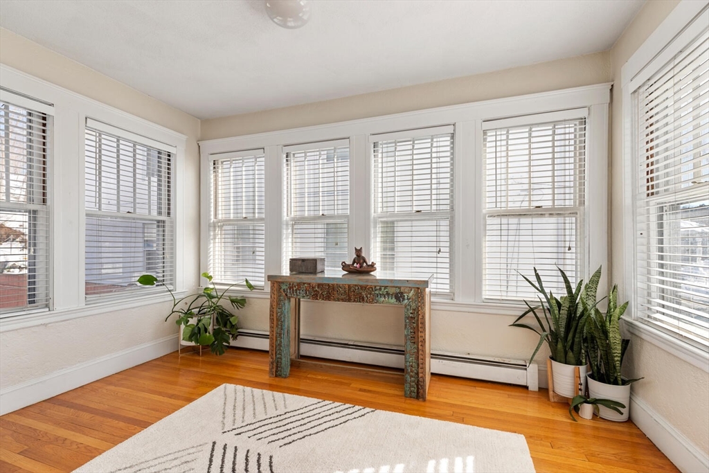 178 Norfolk Avenue, Unit 178 Swampscott, MA 01907 - Photo 9 of 33 a living room with furniture and large windows