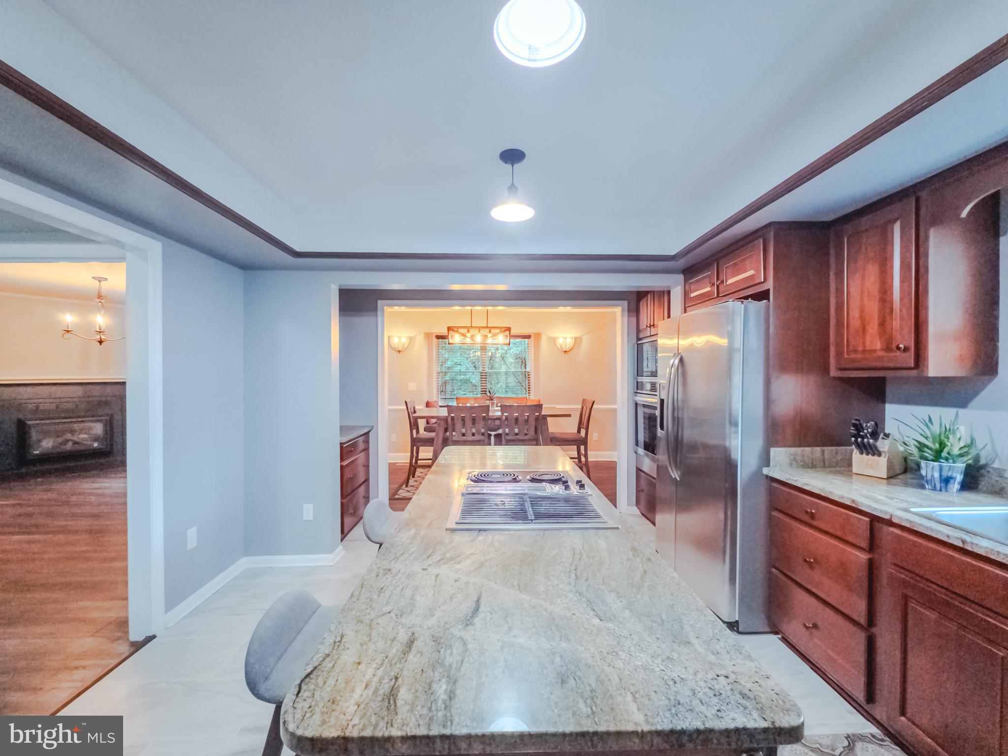 8749 Ramsburg Road Thurmont, MD 21788 - Photo 12 of 61 a large white kitchen with large windows
