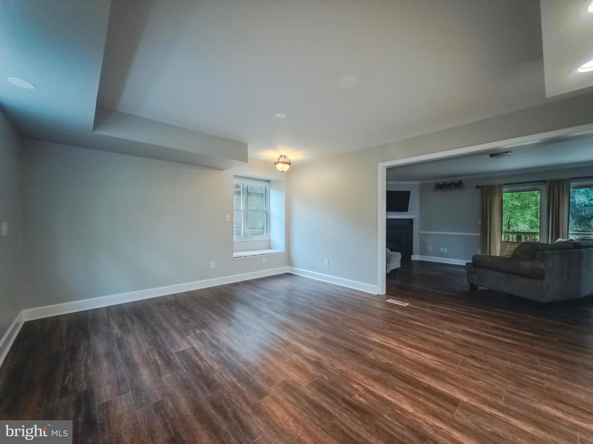 8749 Ramsburg Road Thurmont, MD 21788 - Photo 21 of 61 an empty room with wooden floor and windows