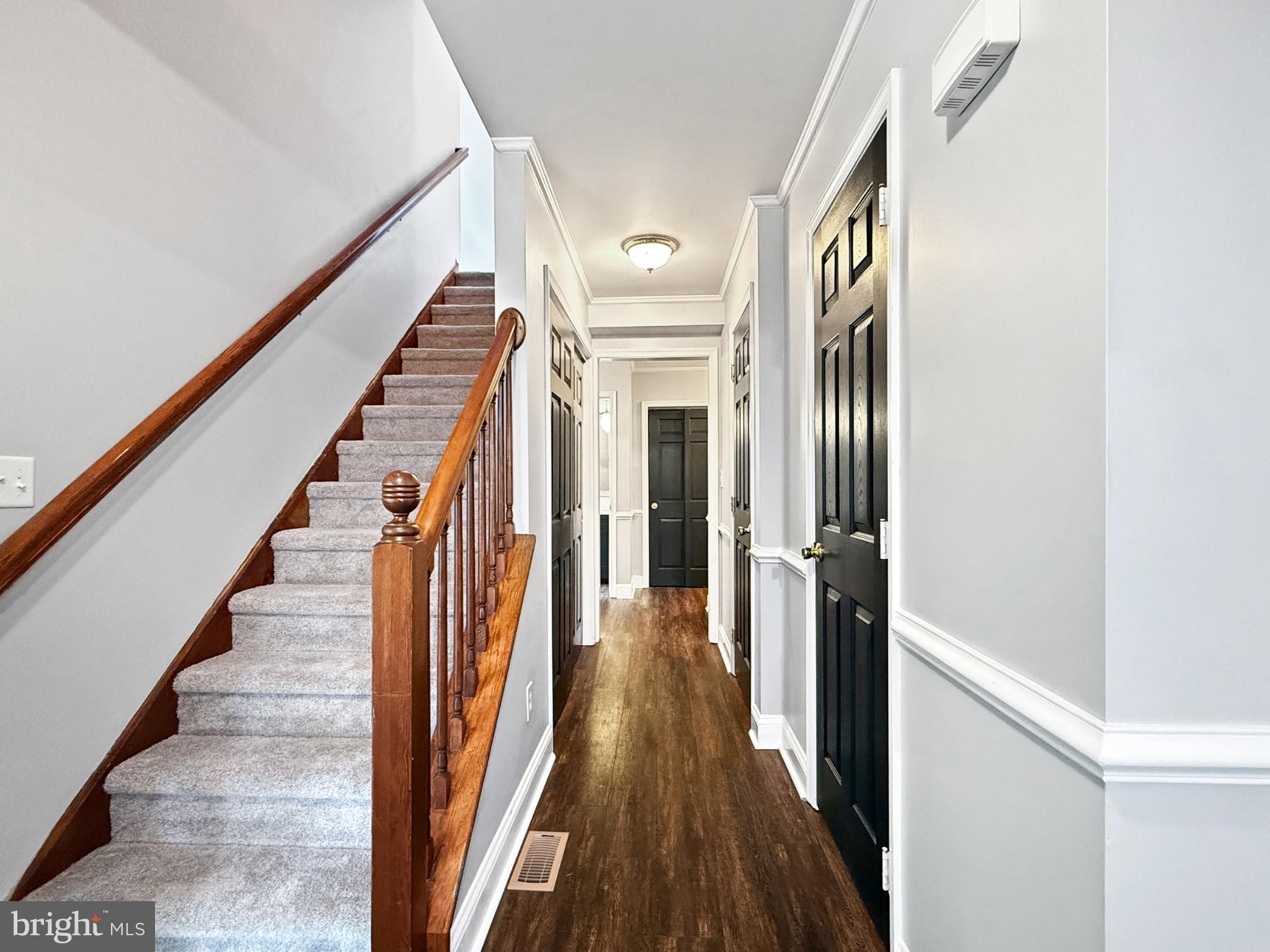 8749 Ramsburg Road Thurmont, MD 21788 - Photo 23 of 61 a view of a hallway with wooden floor and staircase