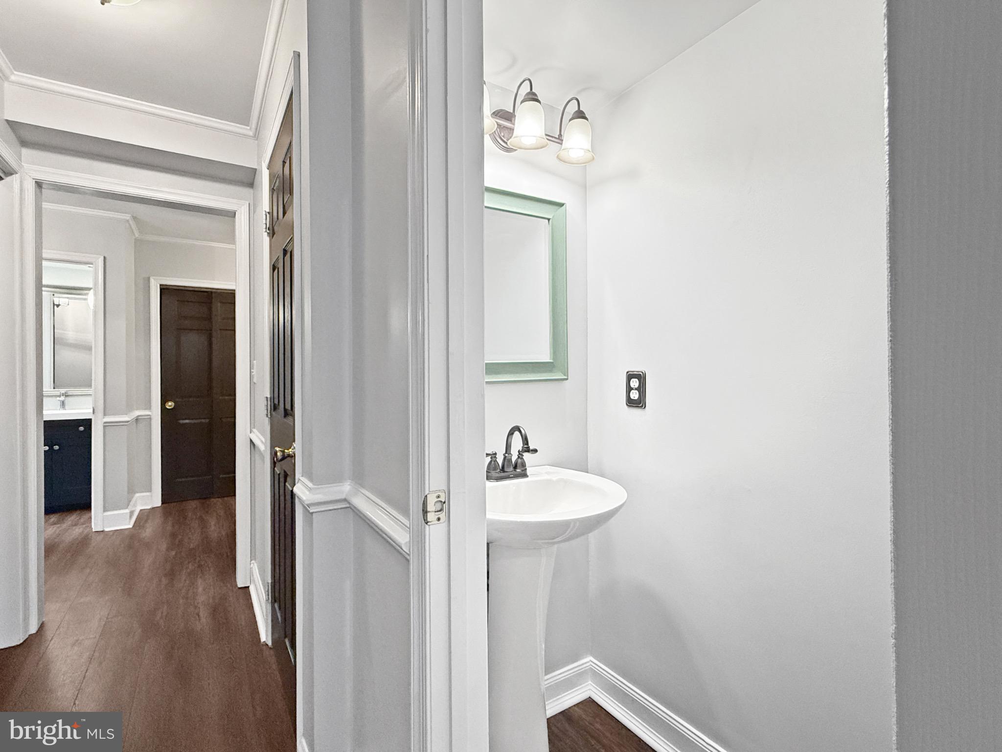 8749 Ramsburg Road Thurmont, MD 21788 - Photo 24 of 61 a bathroom with a sink a mirror and a toilet