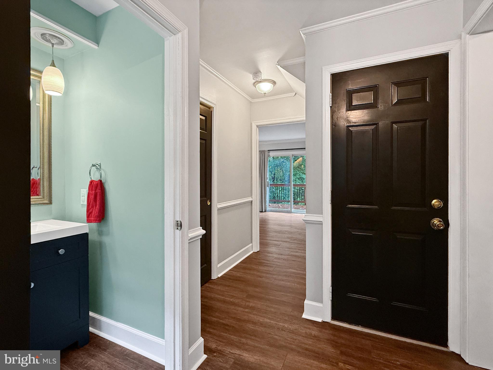 8749 Ramsburg Road Thurmont, MD 21788 - Photo 26 of 61 a view of a hallway with wooden floor and closet