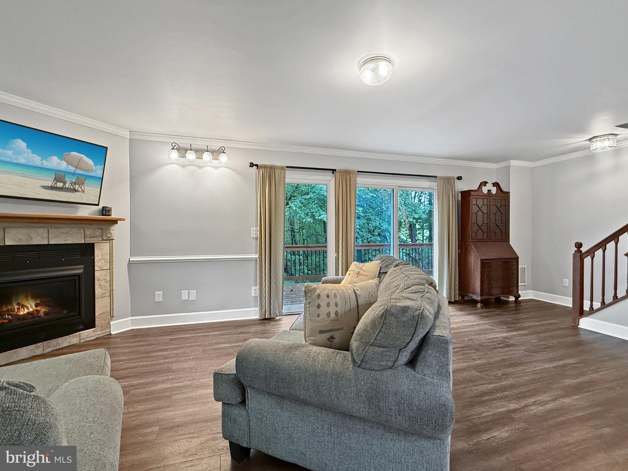 8749 Ramsburg Road Thurmont, MD 21788 - Photo 27 of 61 a living room with furniture and a fireplace