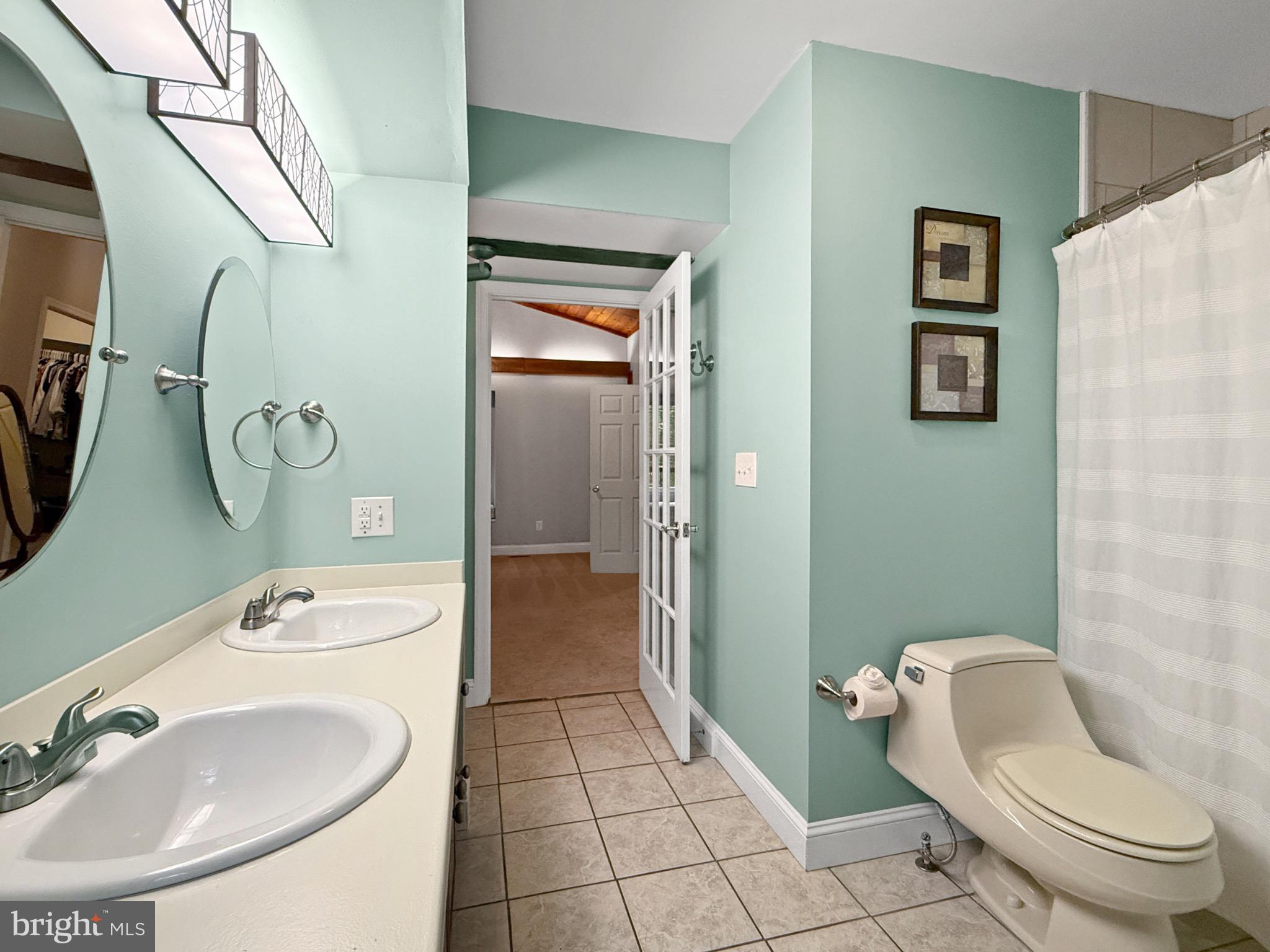 8749 Ramsburg Road Thurmont, MD 21788 - Photo 29 of 61 a bathroom with a toilet sink and mirror