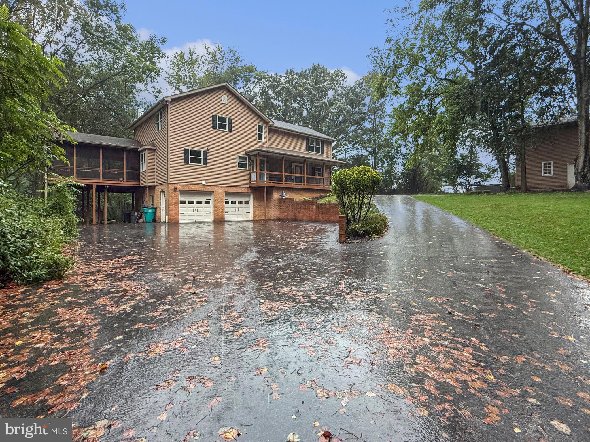 8749 Ramsburg Road Thurmont, MD 21788 - Photo 3 of 61 a front view of a house with garden