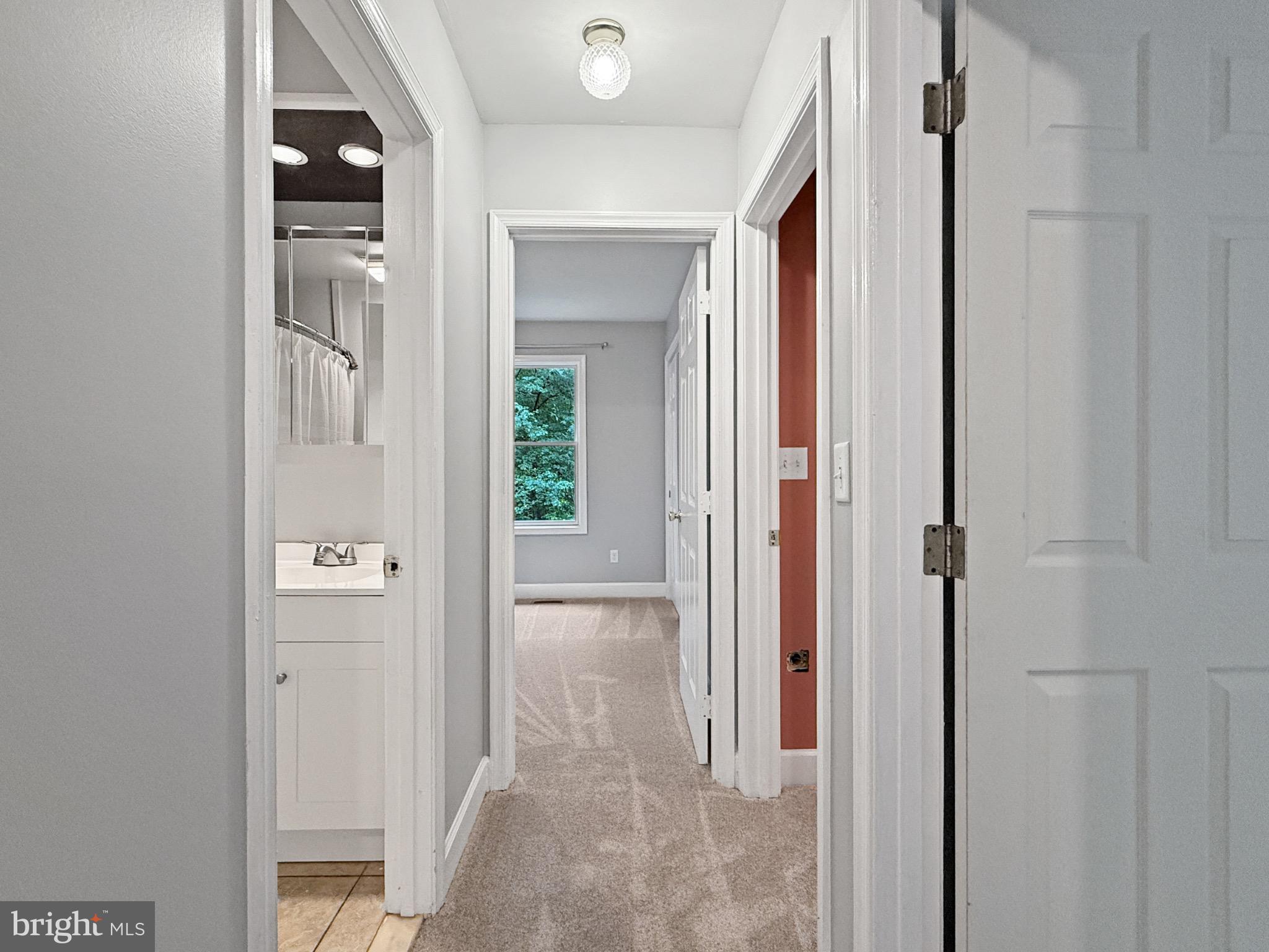 8749 Ramsburg Road Thurmont, MD 21788 - Photo 37 of 61 a view of a bathroom from a corridor