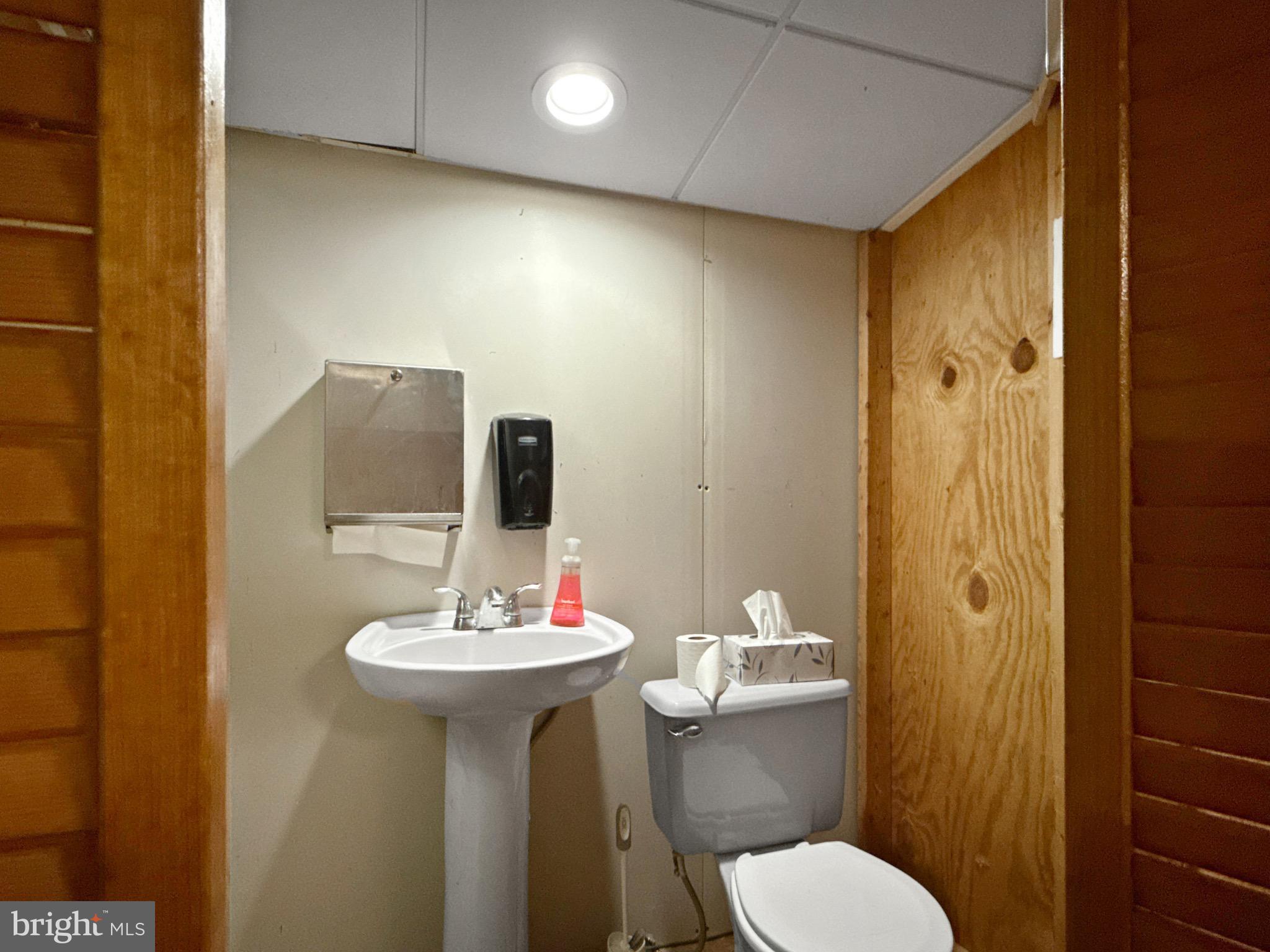 8749 Ramsburg Road Thurmont, MD 21788 - Photo 57 of 61 a bathroom with a sink toilet and shower