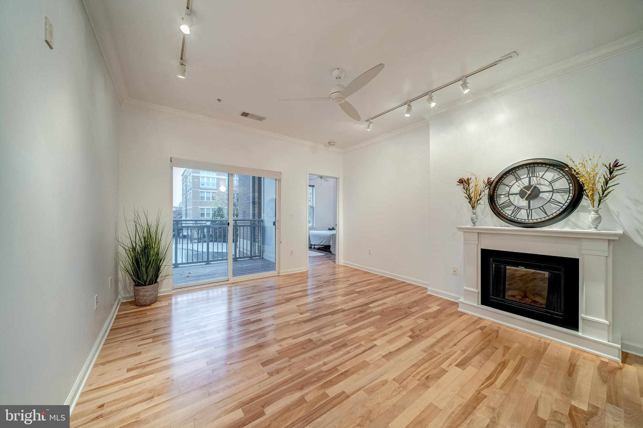 12000 Market Street, Unit 235 Reston, VA 20190 - Photo 13 of 45 Living Room with Deck Access