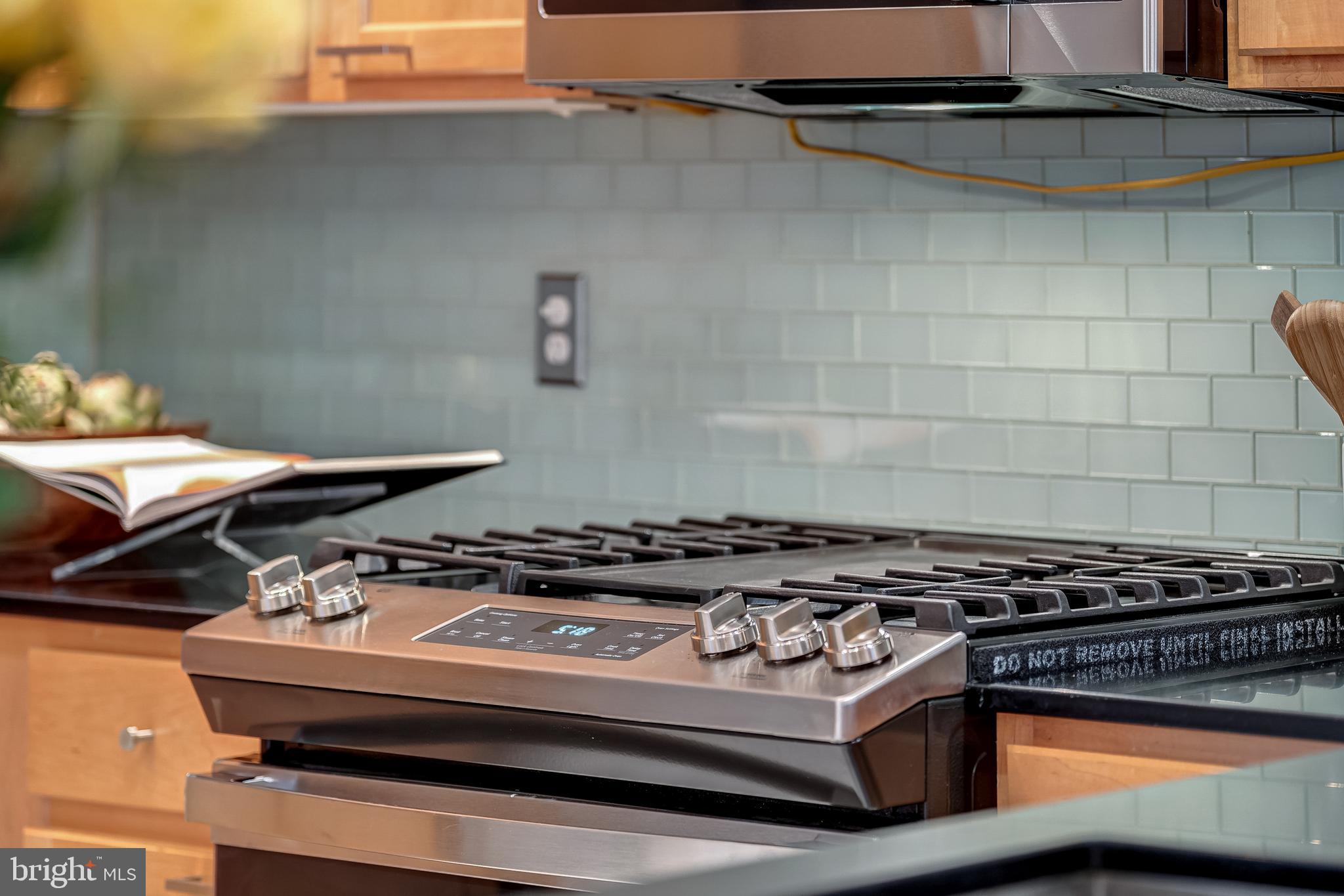 12000 Market Street, Unit 235 Reston, VA 20190 - Photo 24 of 45 Chef's Gas Range
Glass Tile Backsplash