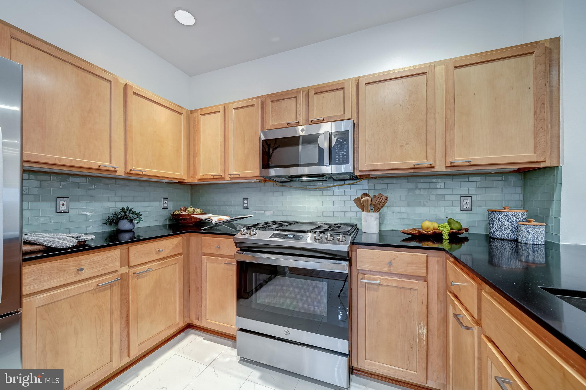 12000 Market Street, Unit 235 Reston, VA 20190 - Photo 25 of 45 Sleek Maple Cabinetry