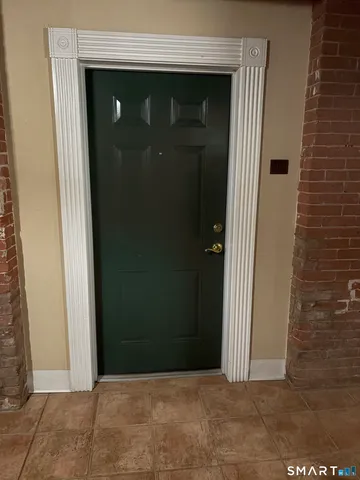 a kitchen with stainless steel appliances granite countertop a refrigerator a stove a sink a microwave and island