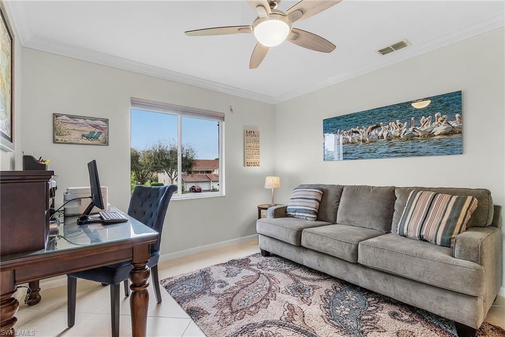 6780 Dennis Circle, Unit M206 Naples, FL 34104 - Photo 12 of 26 a living room with furniture and a couch