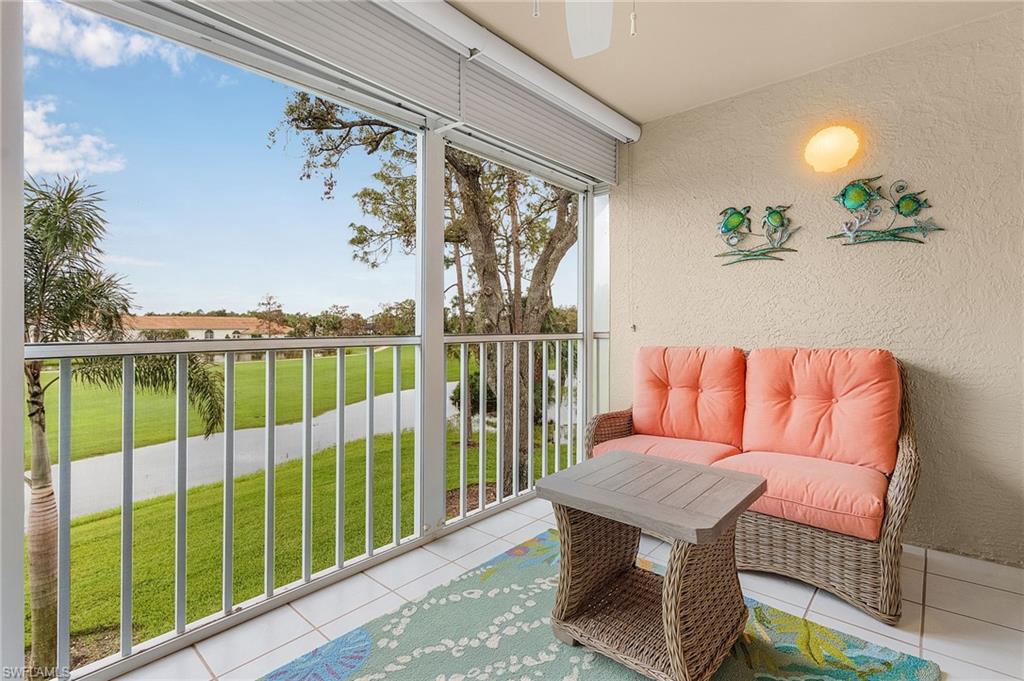 6780 Dennis Circle, Unit M206 Naples, FL 34104 - Photo 20 of 26 a balcony with furniture and a potted plant