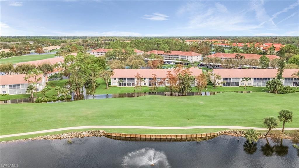 6780 Dennis Circle, Unit M206 Naples, FL 34104 - Photo 25 of 26 a view of a city with a lake