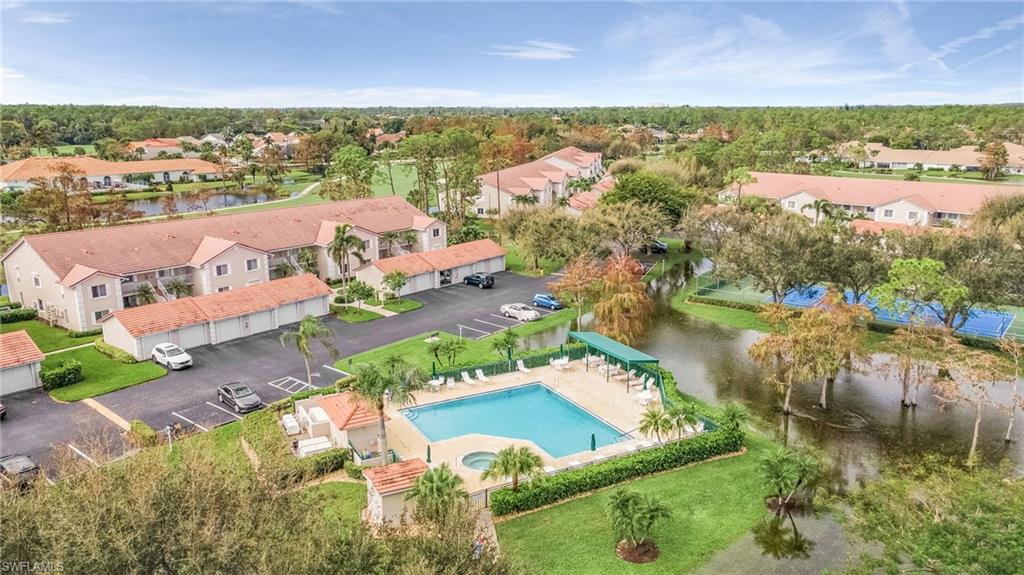 6780 Dennis Circle, Unit M206 Naples, FL 34104 - Photo 8 of 26 an aerial view of residential houses with outdoor space and river