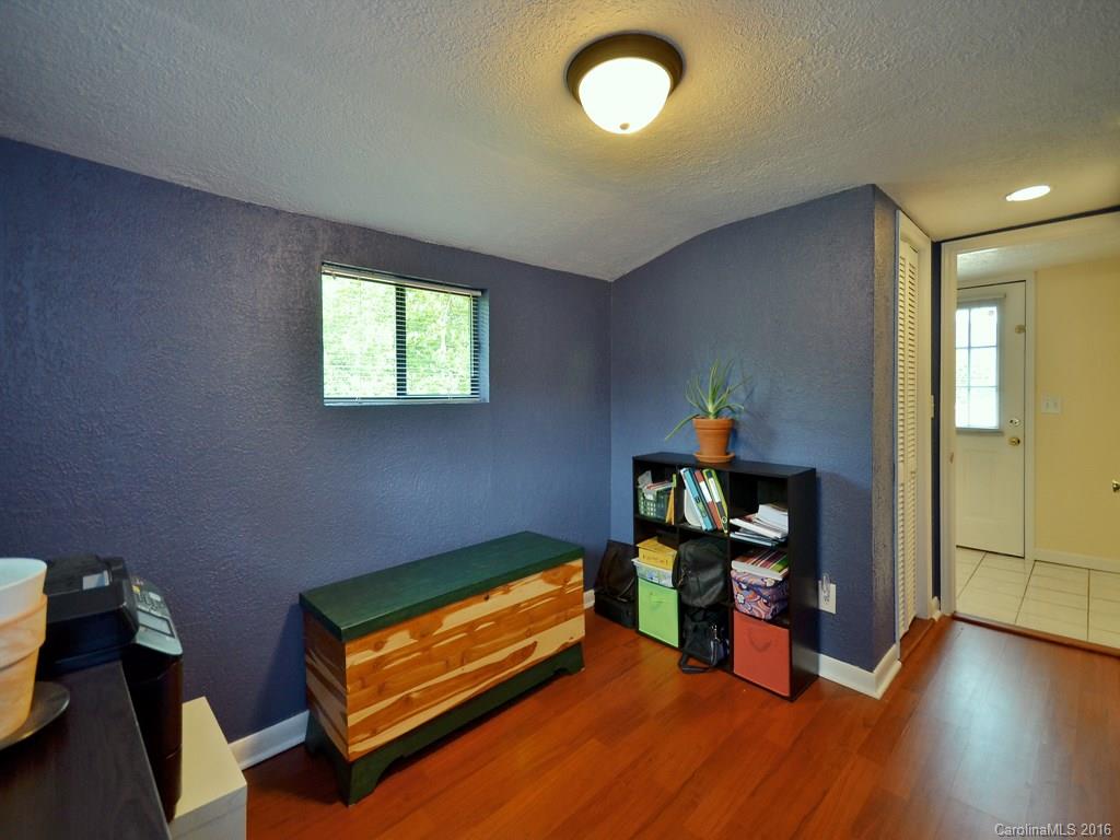 442 Thompson Cove Road Clyde, NC 28721 - Photo 7 of 20 a room with wooden floor and furniture