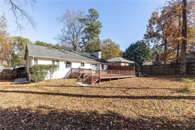 a view of a big room with closet and windows