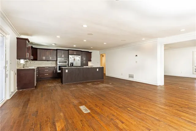 a view of kitchen and wooden floor